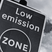 Black and white image of road sign stating low emission zone.