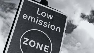 Black and white image of road sign stating low emission zone.